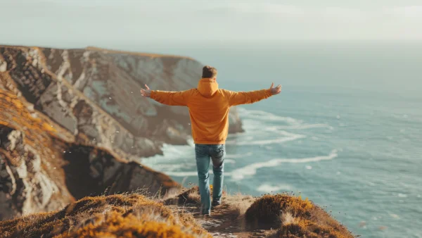 Man looking out to sea happy to have changed his life for the better